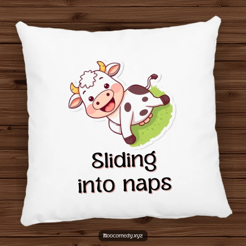 Funny pillow featuring a happy cow with a large grin sliding down a grassy hill.