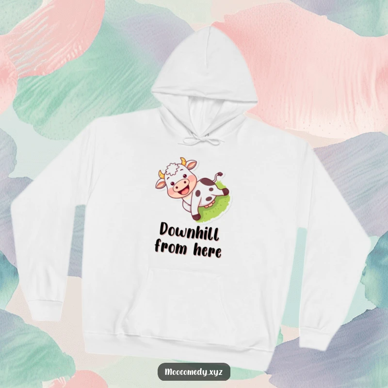 Funny hoodie showing a happy cow sliding down a grassy hill with an infectious grin.